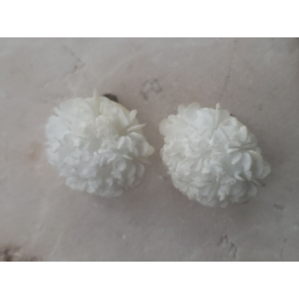 Vintage white celluloid floral carved clip on earrings